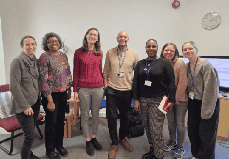 Group of healthcare professionals and staff at Sutton Careers for urgent care patient engagement.