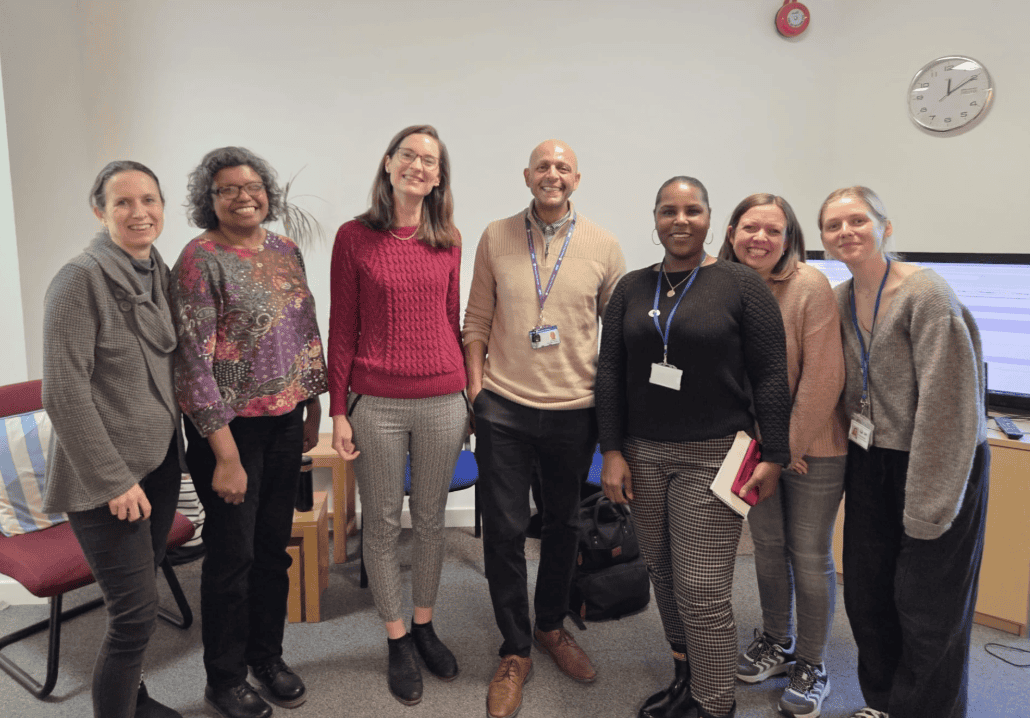 Group of healthcare professionals and staff at Sutton Careers for urgent care patient engagement.